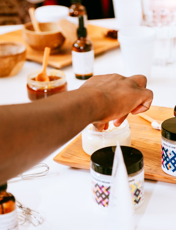 Close-up of Man Touching a Candle 